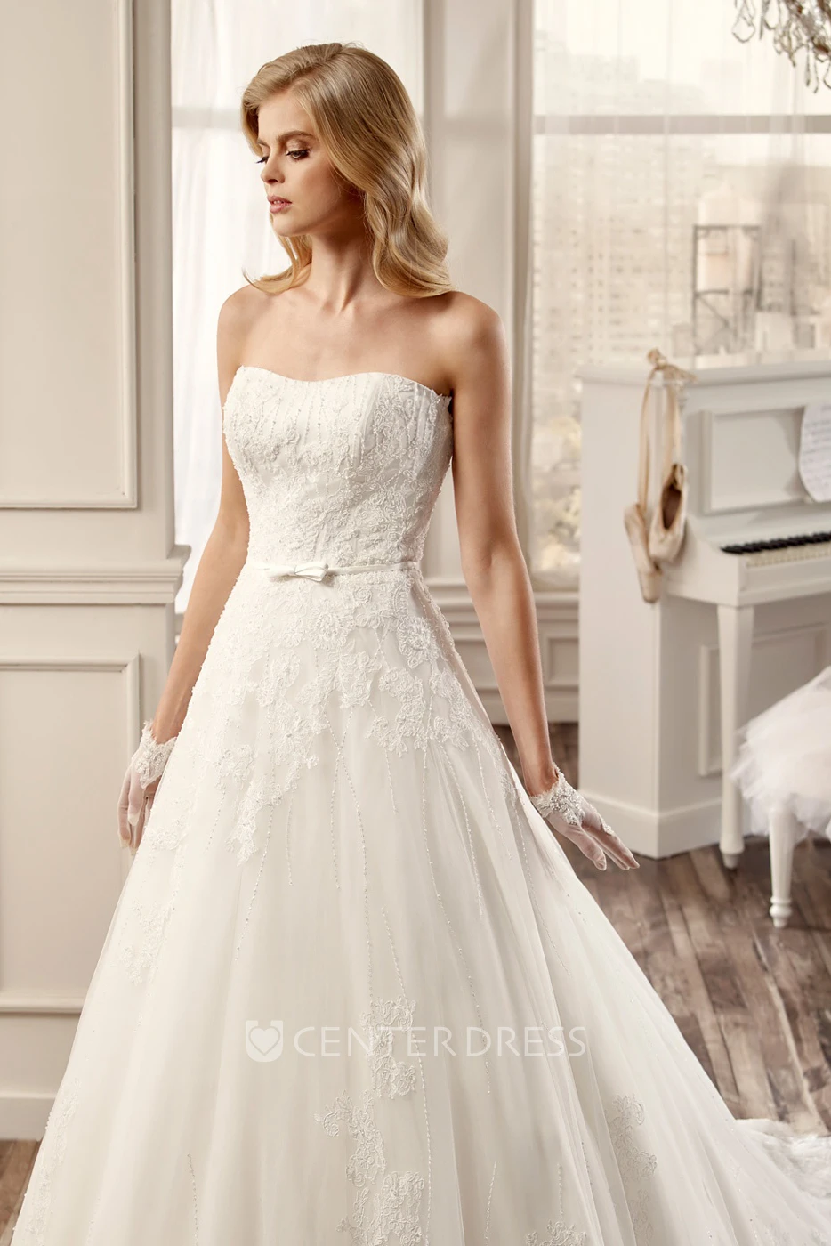 Strapless A-Line Lace Wedding Dress With Appliques And Brush Train