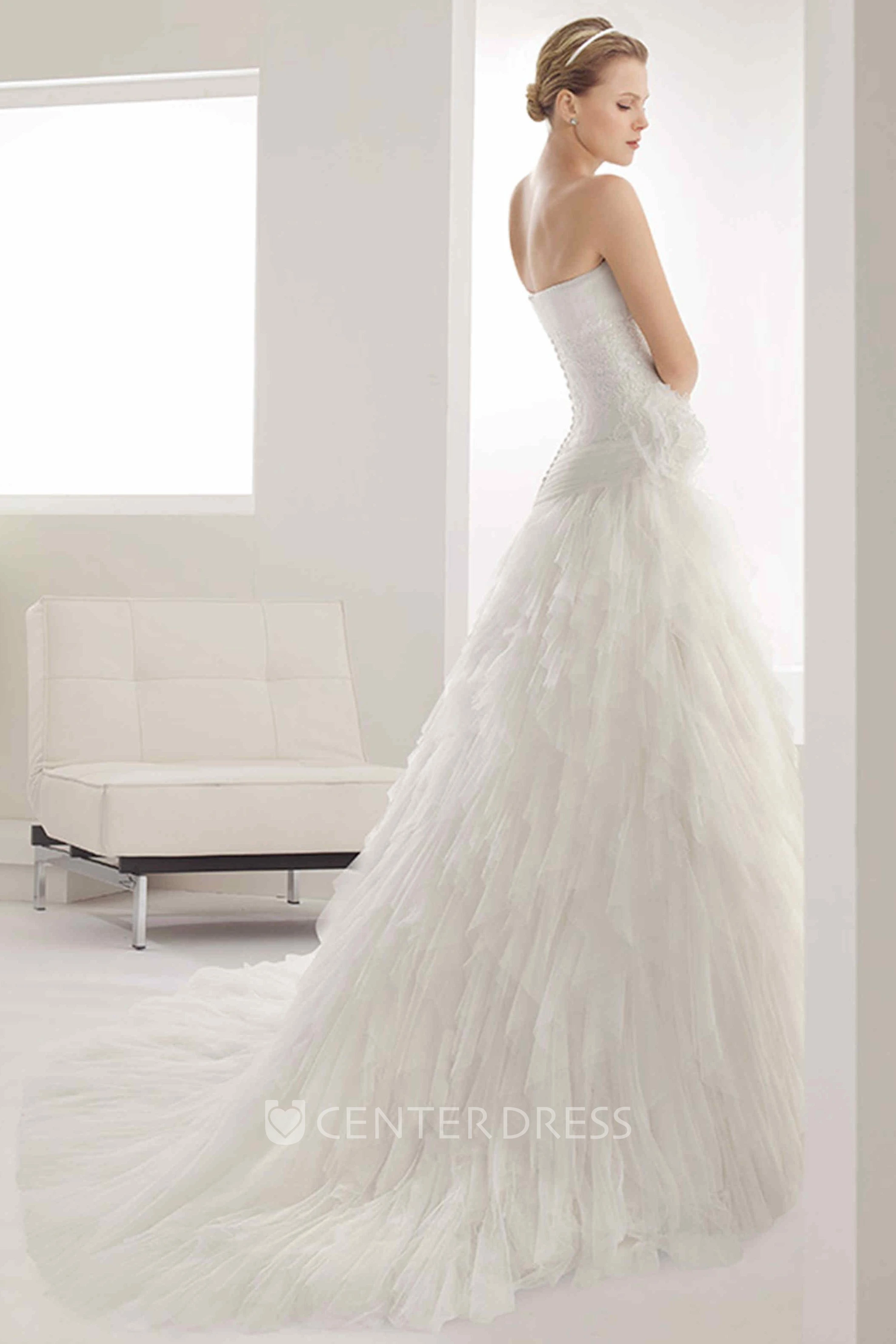 Strapless Tulle Mermaid Gown With Embroidered Waist And Tiered Skirt
