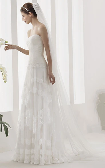 Strapless Tulle Gown With Ruched Bodice And Drop Jewel Waist