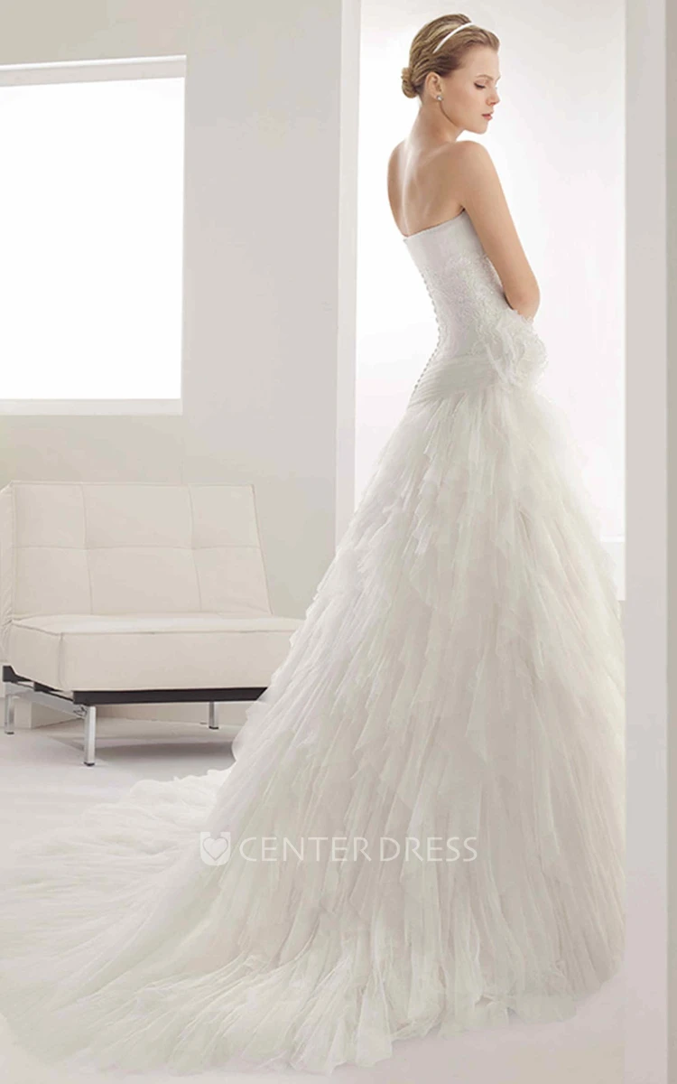 Strapless Tulle Mermaid Gown With Embroidered Waist And Tiered Skirt